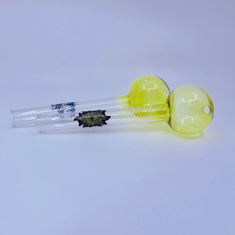 Glass smoking device with yellow bowl and clear chamber on a white background