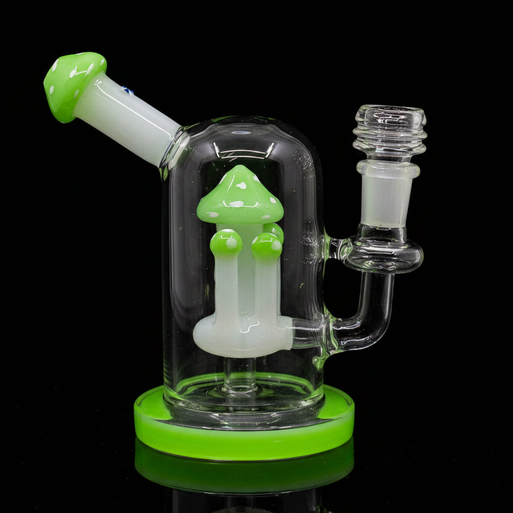 Fungi themed mushroom dab rig made of clear borosilicate glass with green accents for smooth filtration.