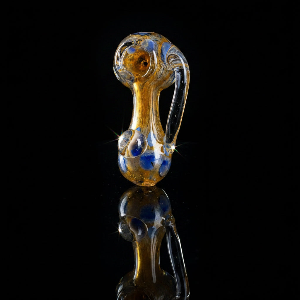 Glass hand pipe with unique one-horned design, 5 inches long, crafted from high-quality borosilicate glass for a smooth smoking experience.