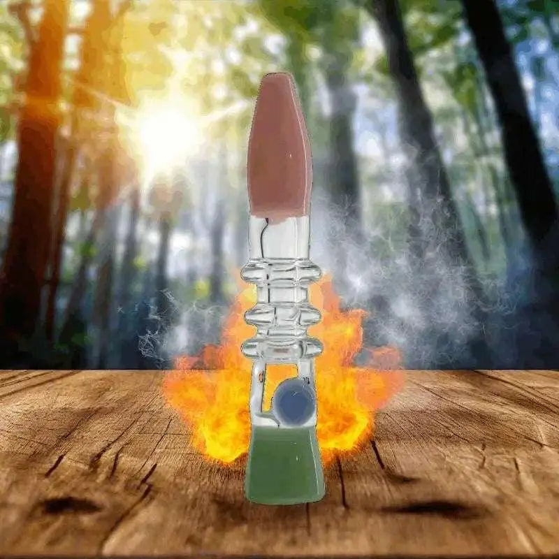 5-inch crystal glass hand pipe with triple ring design on wooden surface with smoke and forest background.