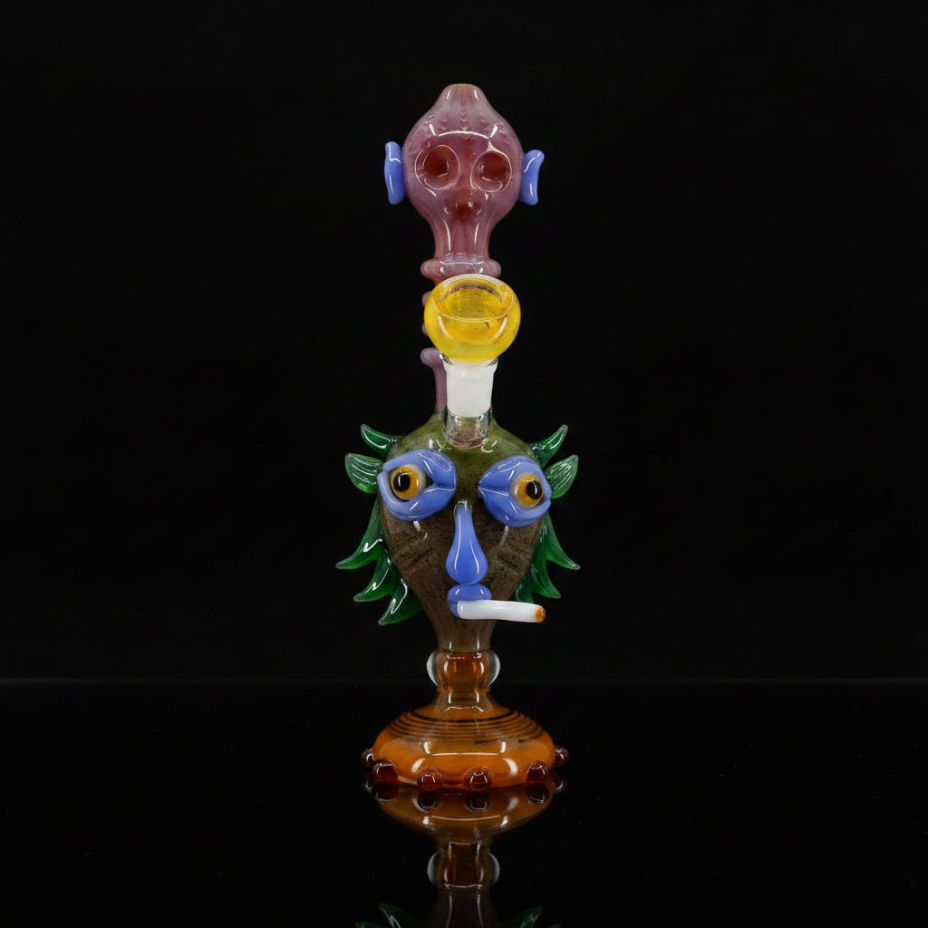 Mayan character water pipe bong, handmade in Nepal, 10-inch borosilicate glass with colorful design.