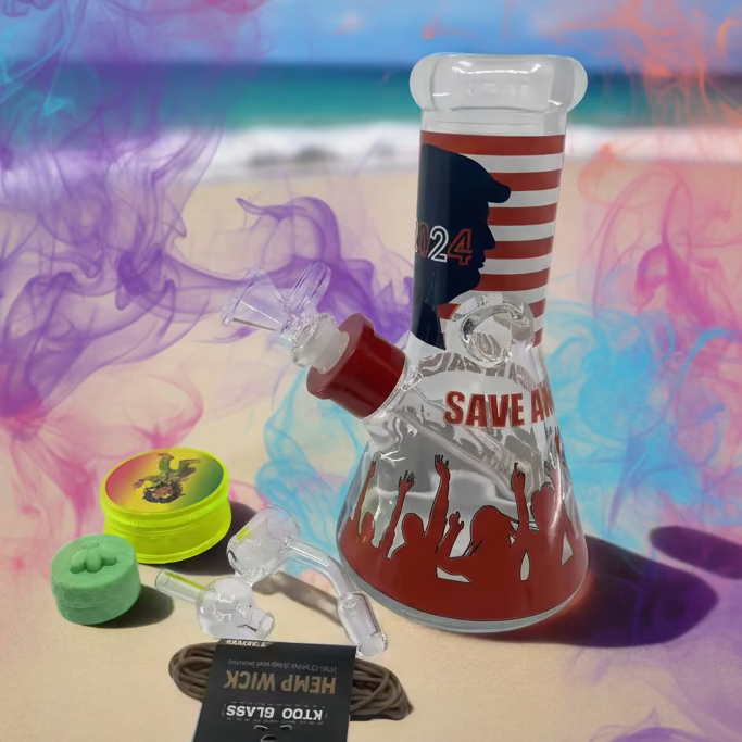 Trump 2024 Bong Box with beach background, featuring an 8-Inch Trump-themed bong, plastic grinder, silicone container, quartz banger, hemp wick, carb cap, downstem, ball & metal dabber.