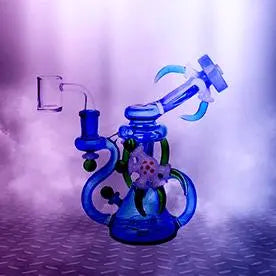 Fancy blue color dab rig on a striped floor and the background has Smoke