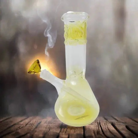 10" Illocution Color American Made Fume Beaker Bong on wooden surface with smoke.