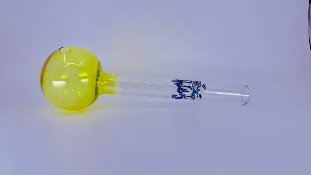 Glass smoking accessory with yellow bubble and blue text on a white background