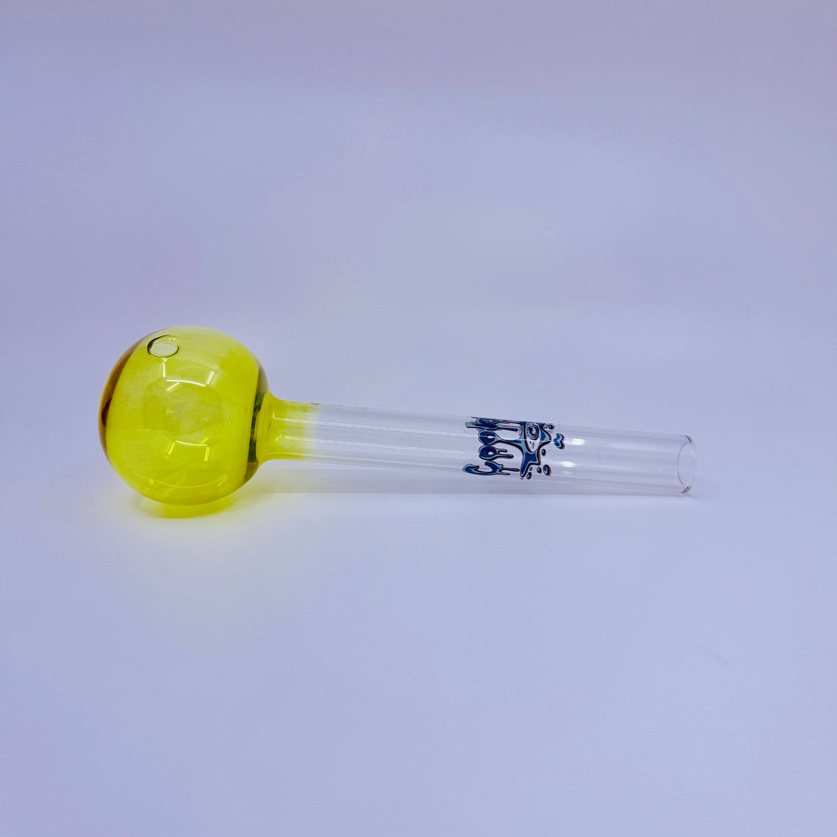 Glass smoking accessory with yellow bowl and blue logo on a white background