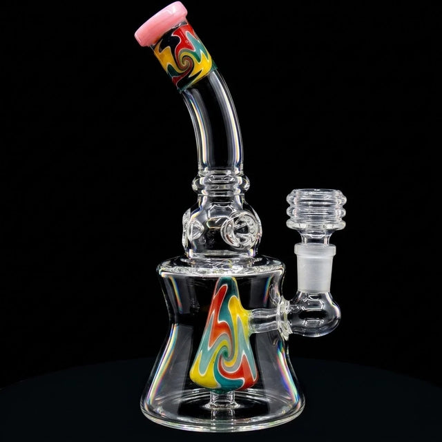 Colorful glass dab rig with a black background
