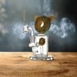 Double Donut Shape Thick Glass Dab Rig on wooden surface with smoke.