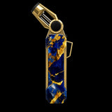 A luxury lighter with a polished gold-tone metal body and a textured blue and gold lapis lazuli stone inlay, shown on a solid white background.