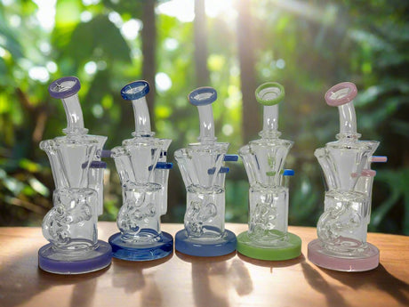 Cute Inline recycle Dab Rig with colorful bases and recycling design displayed outdoors.