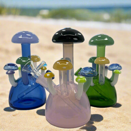 Mushroom Dab Rig with unique design on sandy beach background.