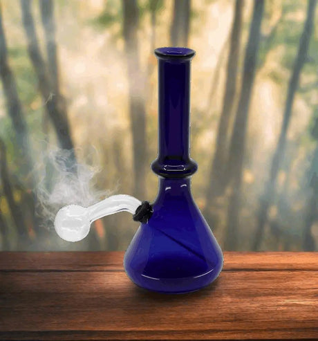 8-inch Color Tube Oil Rig Beaker Bong with vibrant accents and smoke, made from borosilicate glass.