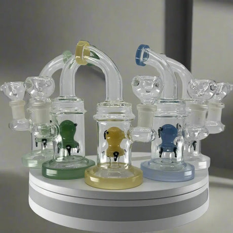 Bent neck dab rigs with animal insult design on display, featuring durable borosilicate glass and enhanced filtration.