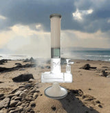 Quintuple Showerhead Inline Perc Bong 16" on beach background, clear borosilicate glass with showerhead percolators, 14mm joint.