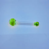 Clear glass pipe with green bowls on a light blue background