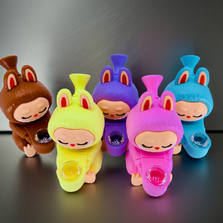 Five colorful cartoon character figurines on a dark surface with a gray background