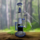 Double Showerhead Inline Straight Dab Rig 13" with blue accents, durable borosilicate glass, double percolators, straight tube design, forest backdrop.