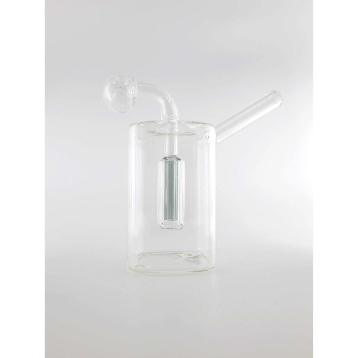 Clear glass dab rig for smoking concentrates, featuring a cylindrical design with a side mouthpiece.