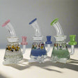 Glycerin inside heavy thick glass craft dab rig with colorful accents for cooler smoking experience.