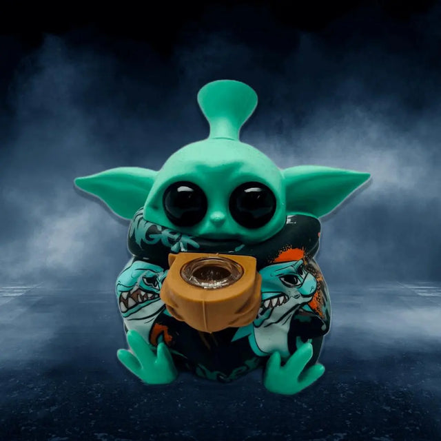 Grogu Baby Yoda silicone water pipe with intricate design and vibrant green color on a dark background.