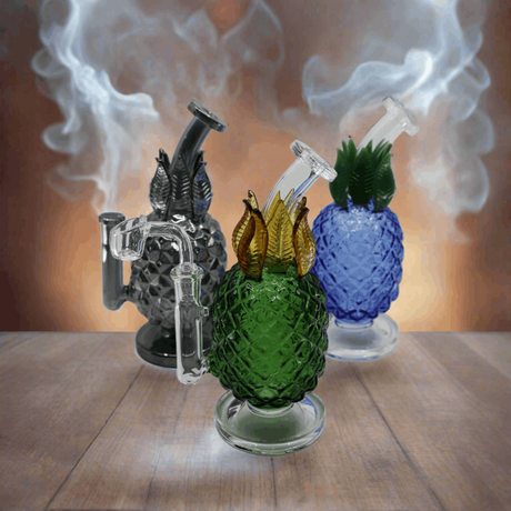 Colorful glass pineapple-themed bong dab rigs with textured design and smoke emanating.