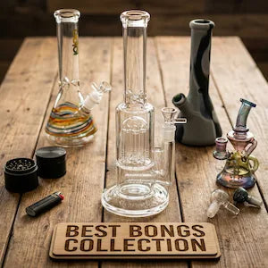 Collection of glass bongs on a wooden surface with a sign reading 'Best Bongs Collection'.